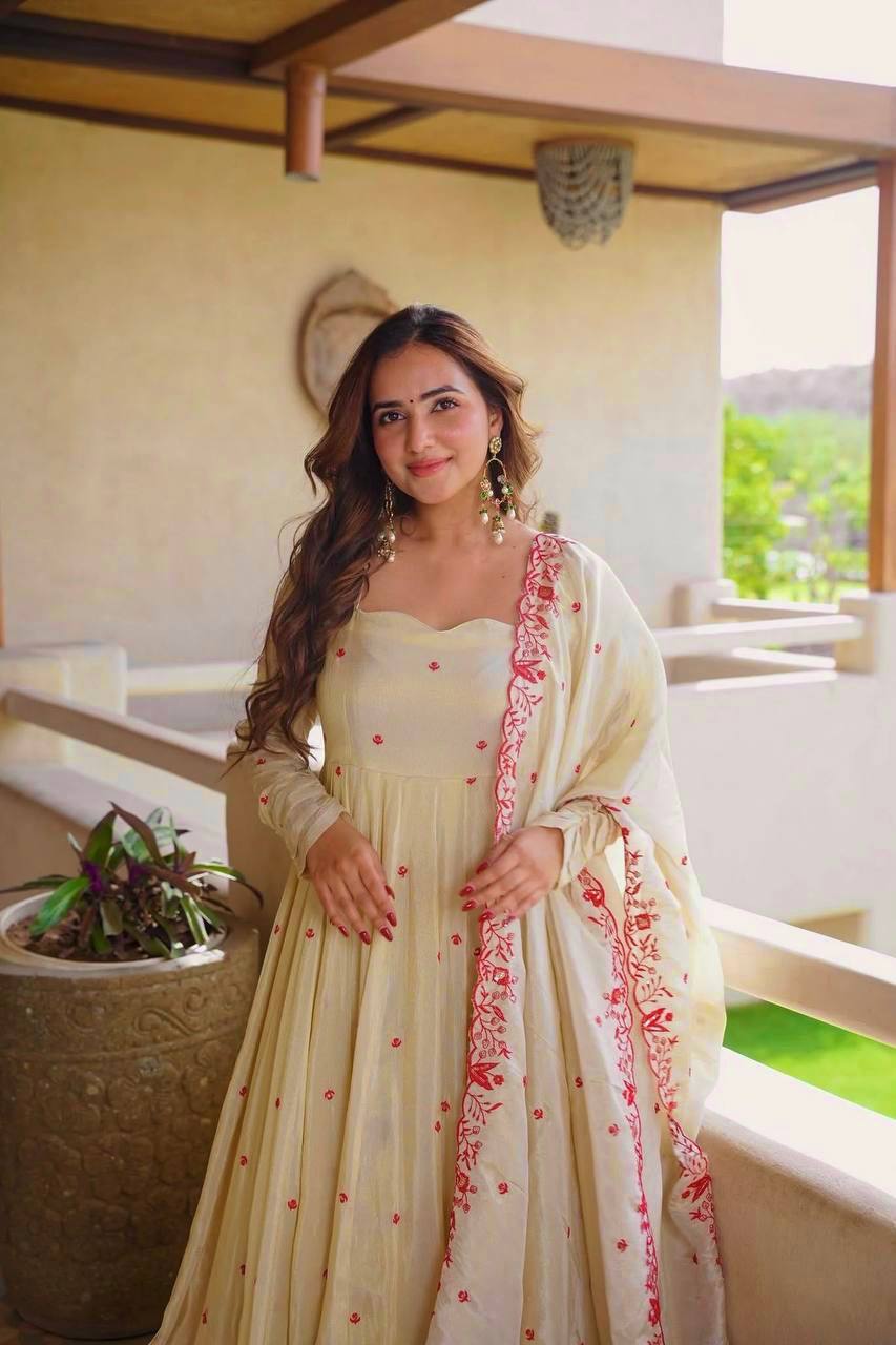 Exquisite Beige Flared Anarkali Suit Set Adorned with Vibrant Red Floral Embroidery, Sequined Scalloped Hem, and an Elegant Tie-Up Back